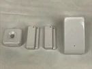 Iris Motion White Model #MOT901, 2 Door Sensors, Range Extender REP800. Fixed Price $29.99.